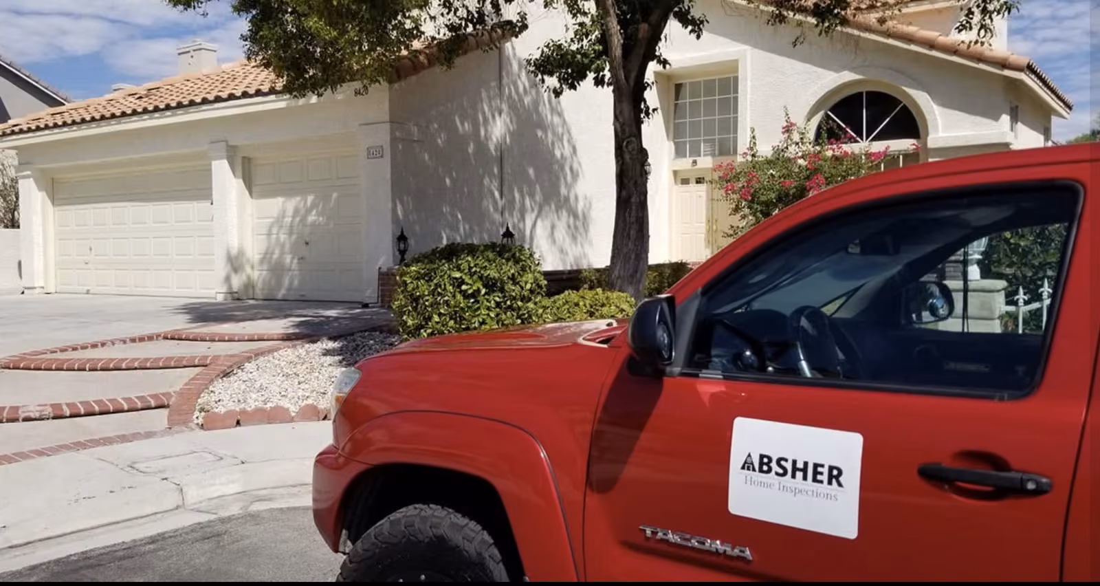 Absher Home Inspections truck outside a home